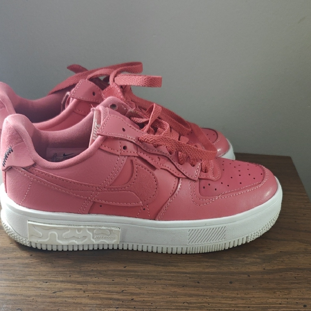 Nike Pink and White Athletic Shoes with Classic Design